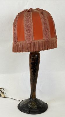 a lamp that is sitting on a table next to a cord