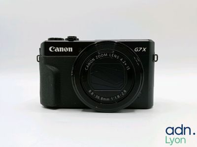 a close up of a camera on a white surface with a white background