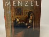 a book with a picture of a man sitting at a table