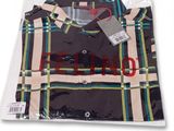 chemise pour homme à carreaux noirs et verts, avec une étiquette rouge