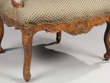 an image of a chair with a brown and tan upholstered seat