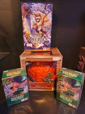 a box of cards and a box of games on a table