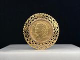 a gold ring with a portrait of a woman on it