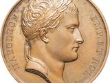 une image d'une pièce d'or avec le profil d'un homme