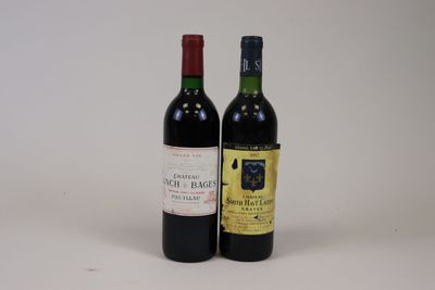 two bottles of wine sitting next to each other on a table