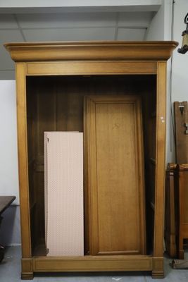 a large wooden cabinet with a radiator in it