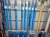 a lot of blue and white pens on display in a store