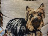 a pillow with a picture of a dog on it