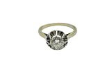 a white gold ring with a round brilliant cut diamond