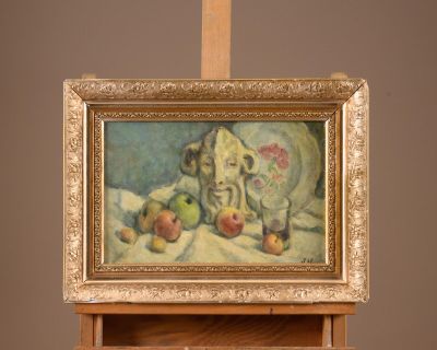a picture of a painting on a easel with apples on it