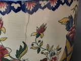 a close up of a bowl with flowers and birds on it