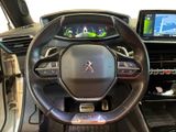 the interior of a car with a steering wheel and dashboard controls