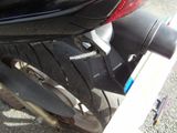 a close up of a motorcycle with a rear tire
