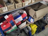 many boxes of clothing on a shelf in a room