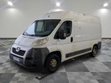 a picture of a white van parked in a room