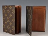 two louis vuitton wallets, one brown and one brown