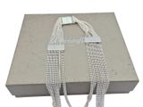 a box with a silver chain and a silver clasp on it