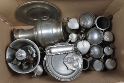 many pots and pans in a cardboard box