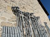 many pipes attached to the side of a building