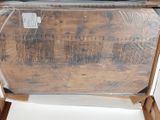 a wooden box that has some kind of furniture inside of it