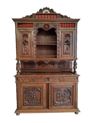 an image of a wooden cabinet with carvings on it
