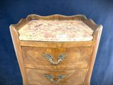a small wooden table with a drawer on top of it