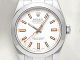 a close up of a watch with a white dial and orange hands
