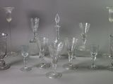 a lot of wine glasses that are sitting on a table