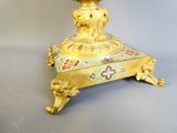 a gold vase sitting on top of a table