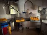 an image of a kitchen with a lot of food on the counter
