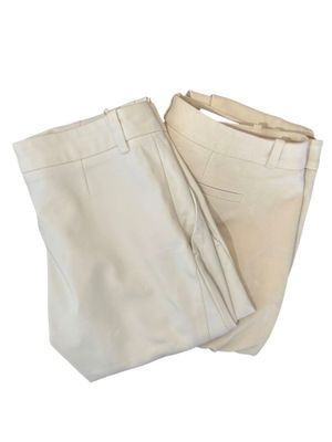pair of beige pants on a white background with a white background