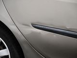 a close up of a car door handle with a sticker on it