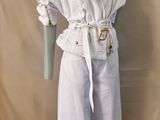a mannequin with a white coat and white pants