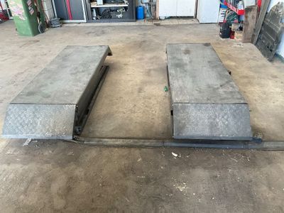 two concrete benches in the middle of a garage