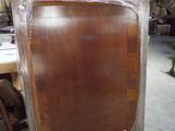 a picture of a piece of furniture that is being wrapped in plastic