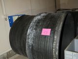 a large metal barrel with a pink sticker on the side of it