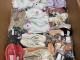 a cardboard box filled with assorted items for sale