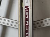 a ski that is leaning up against the wall