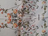 an image of a close up of a piece of fabric with flowers on it