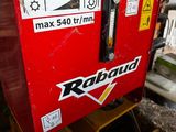 a red machine that is sitting on the ground