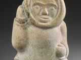 an image of a stone statue of a man with a hat on his head