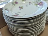 many plates stacked on top of each other in a box