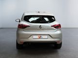 the rear end of a silver car in a white room