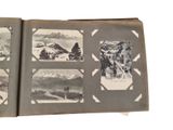 an open book with pictures of mountains in it