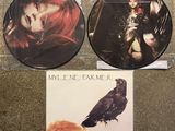 two cd ' s with a picture of a woman and a bird on them