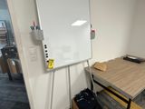 a white board on the wall in a room