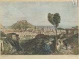 vue d'une ville avec, au loin, un château perché sur une colline