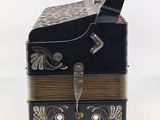 a small black box with a gold band around it