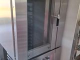 a stainless steel oven with a glass door in a kitchen