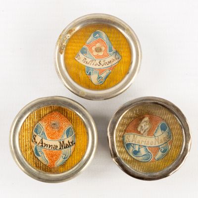 three small tins with a picture of a cat and a dog on them
